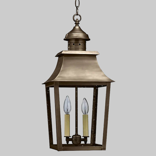 Bronze hanging lantern with two candle-like lights on a white background