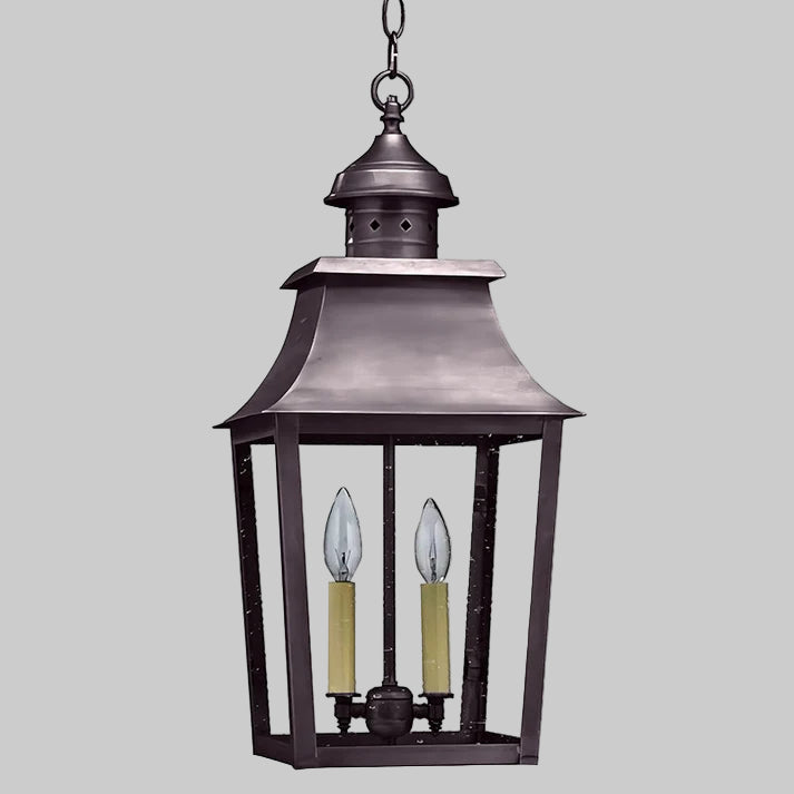 Decorative hanging lantern with two candle-like lights on a white background