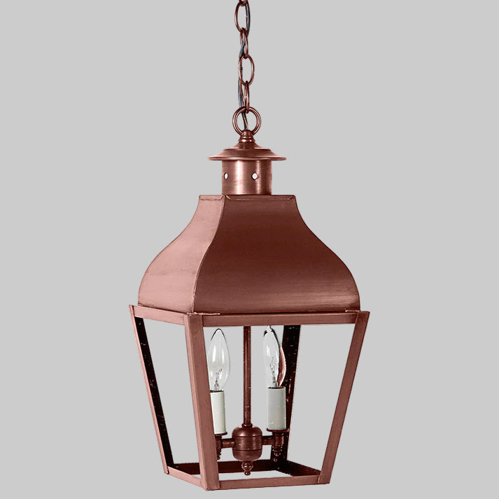 Copper hanging lantern with glass panels on a white background