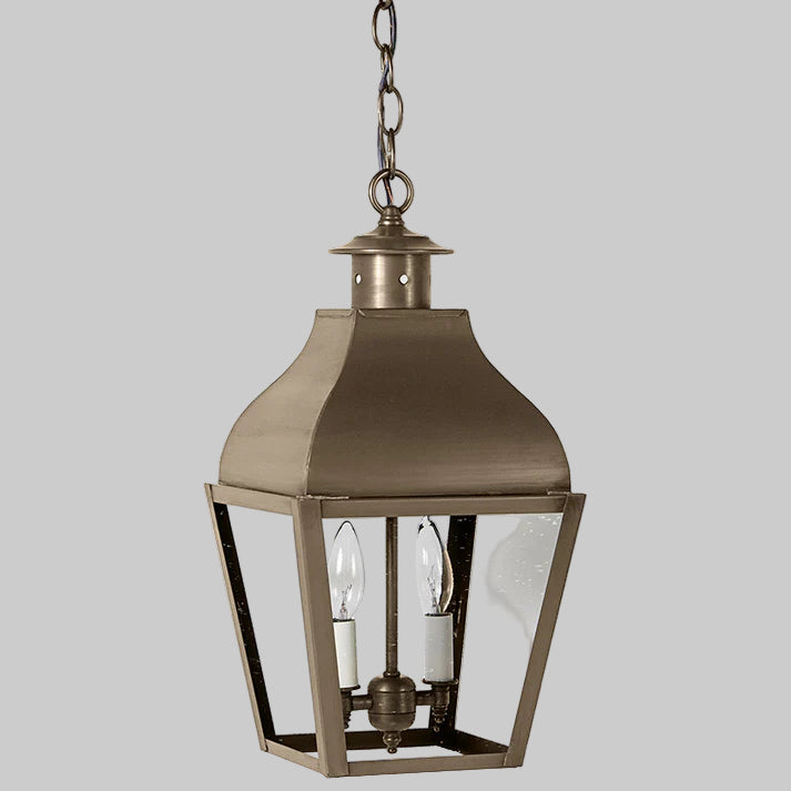 Bronze hanging lantern with clear glass on a white background