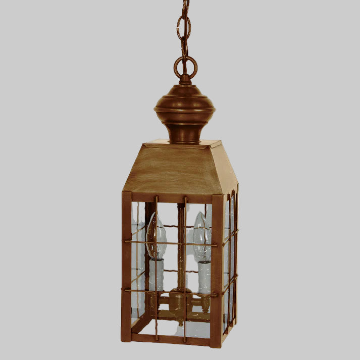 Bronze hanging lantern with glass panels on a white background