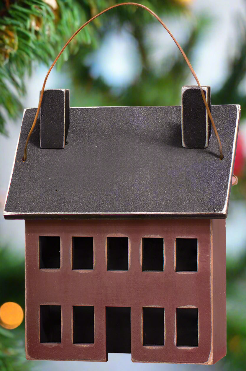 Burgundy saltbox house ornament on white background