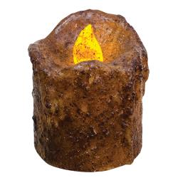 A brown wax mini drip timer pillar candle with an orange lit flame, coated in burnt mustard wax with a cinnamon scent.
