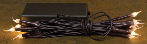 Black power adapter with multiple cables on a wooden surface