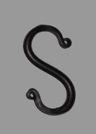 Mini wrought iron forged s hook on white background.