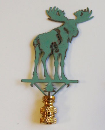 A green copper lamp finial in the shape of a moose, with a verdigris finish.