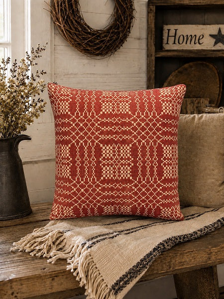Pillow sitting on a bench in a primitive mud room.