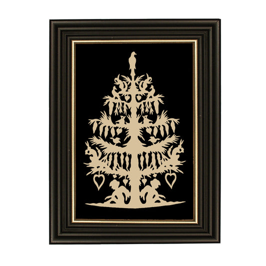 A framed scherenschnitte artwork featuring a tree with cut-out shapes and two figures, set on a black background with gold trim around the frame.