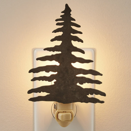 A night light that resembles a tree with a warm light emitting from the top, mounted on a wall.