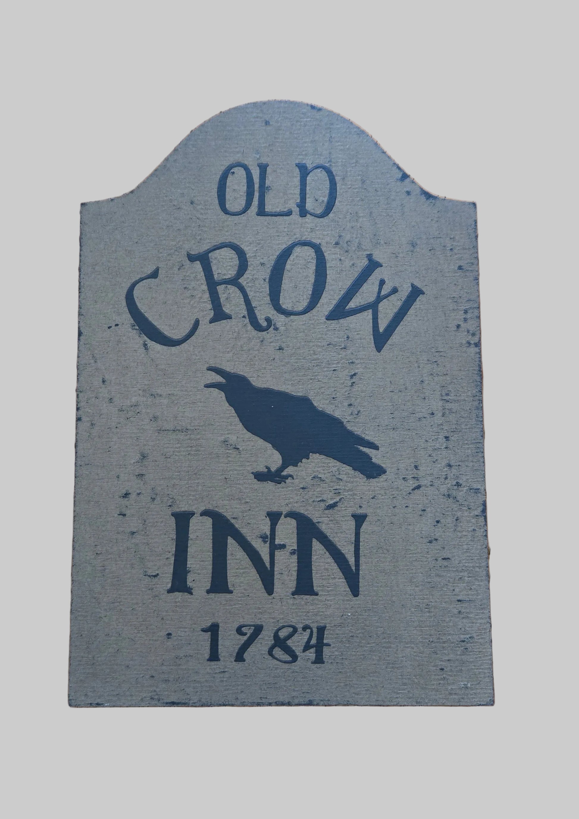 Decorative sign for 'Old Crow Inn 1784' with a crow illustration on a wooden background