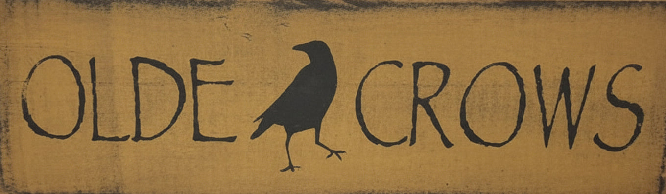 Wooden sign with 'Olde Crows' text and crow illustration on a white background