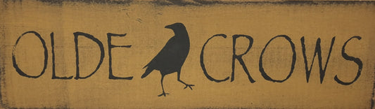 Wooden sign with 'Olde Crows' text and crow illustration on a white background