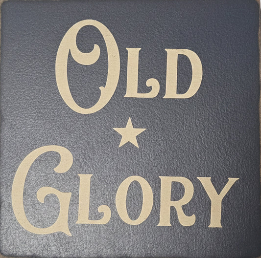 Text 'Old Glory' with a star on a textured gray background
