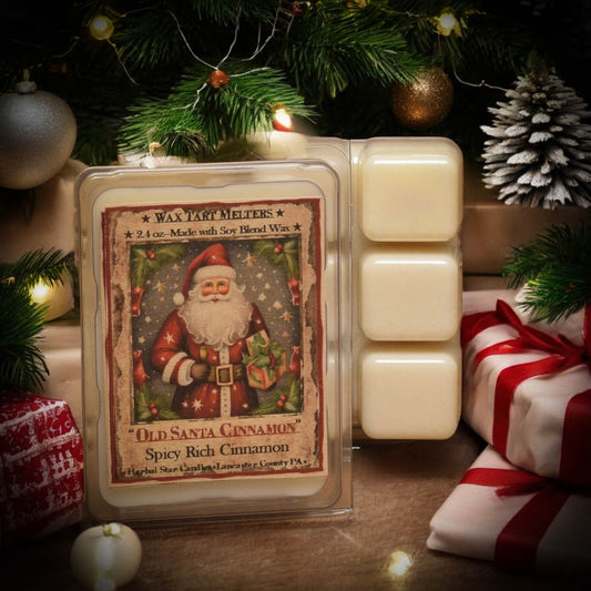 Packaging of wax melts with Santa artwork surrounded by wrapped presents under a tree
