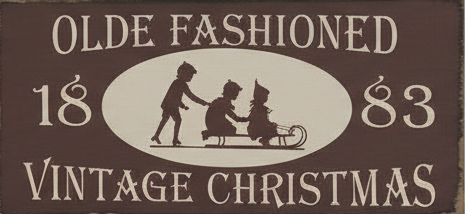 Decorative sign with 'Olde Fashioned Vintage Christmas' text and silhouette of people with a sleigh.