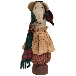 Olde Thyme Christmas Mouse wearing a tan dress and red-and-green plaid scarf, seated on a rust-colored pincushion with a pedestal base