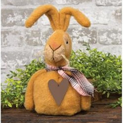 Ollie Mae rabbit wearing scarf and has a rusty heart on the front