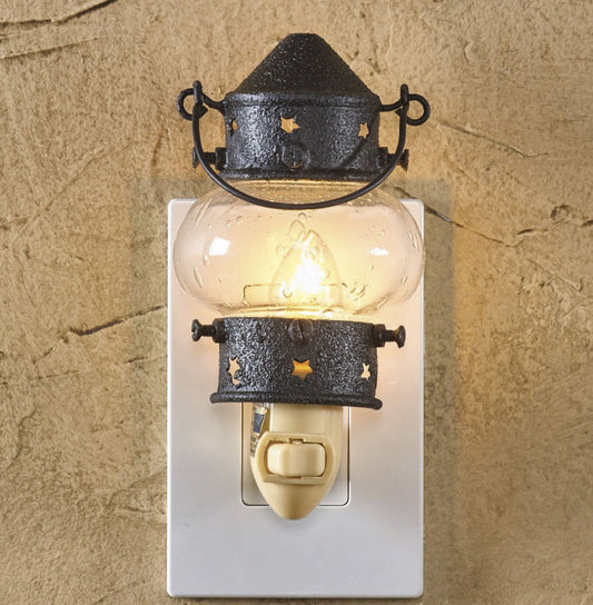 Onion lantern night light with stars plugged into white outlet