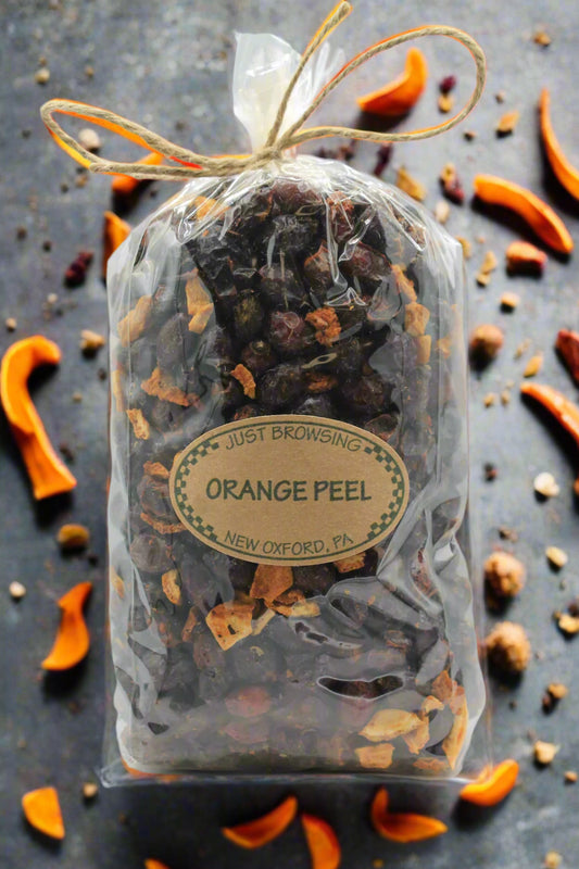 Bag of orange peel with a label on a white background