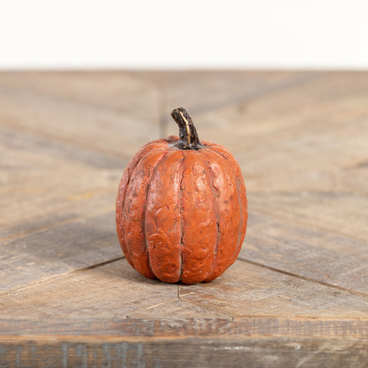 Orange color pumpkin on wooden surface