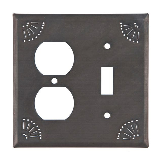 A rectangular tin wall plate with a matte black finish, featuring two circular cut-outs for outlets or switches, and decorative chisel marks around the edges.