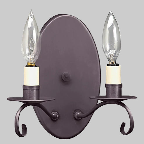 Decorative wall sconce with two candle-style light bulbs on a gray background