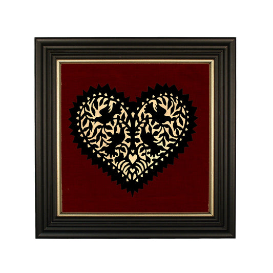 A black paper cut silhouette of four lovebirds in the shape of a heart, with a cream paper background, framed in a solid ash wood frame with gold trim.