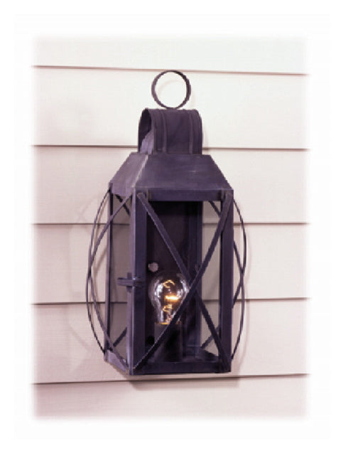 Electrified wall light with bowed cross bars mounted on a house with cream siding