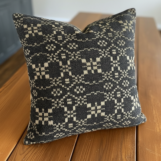 Decorative pillow with a geometric pattern on a wooden surface