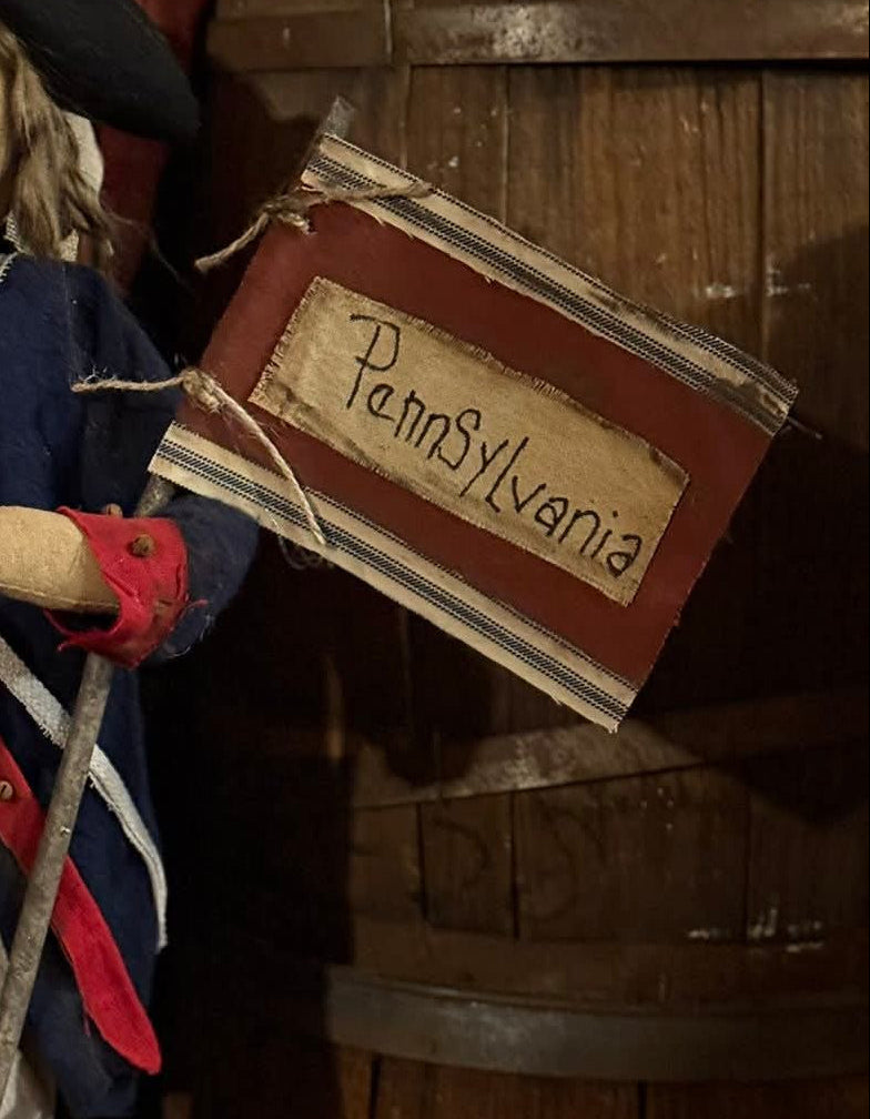 Flag on a stick with the word "Pennsylvania"