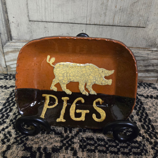 Small rectangular ceramic plate with animal motif and the word 'PIGS'