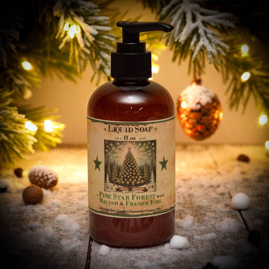 Liquid soap bottle with a festive label on a decorative background with lights and ornaments.