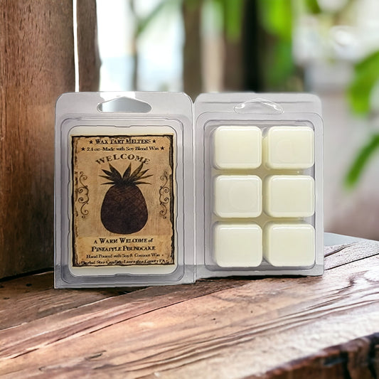 Mini Pineapple Poundcake wax tarts in a clear breakaway clamshell packaging displaying six square pieces of wax. The label shows a pineapple and the scent name.