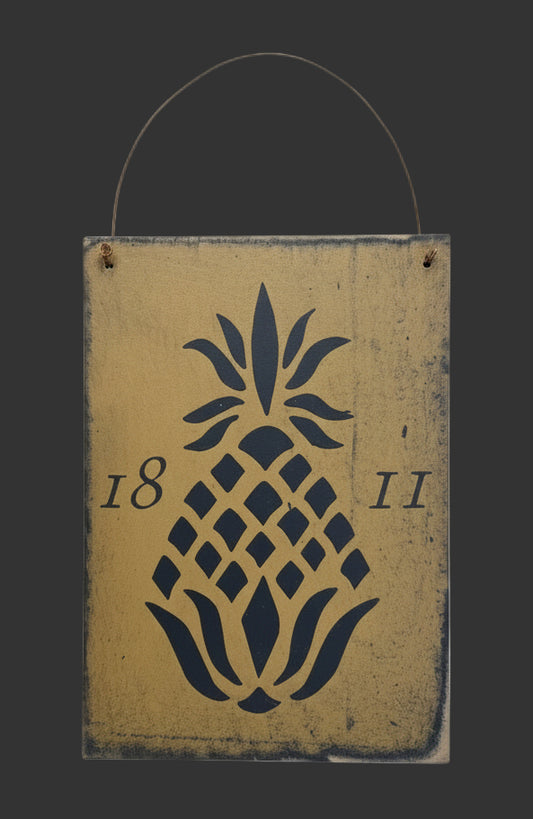 Decorative sign with pineapple design and numbers on a wooden background