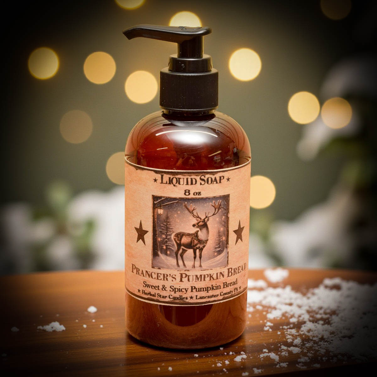 Bottle of Prancer's Pumpkin Bread liquid soap on a wooden surface with blurred lights in the background