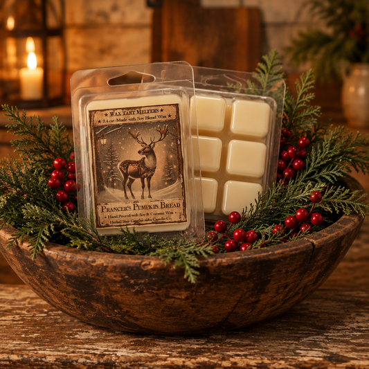 A packaged wax melt set displayed in a rustic wooden bowl with evergreen branches and red berries. The front package shows a deer illustration and the text 'WILD WEST ALEES & CO.