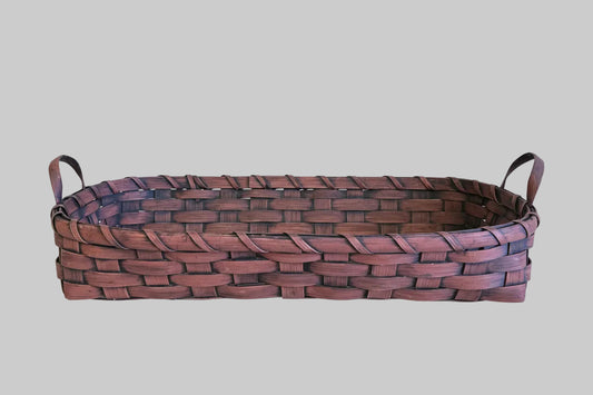 Woven basket on a grey background