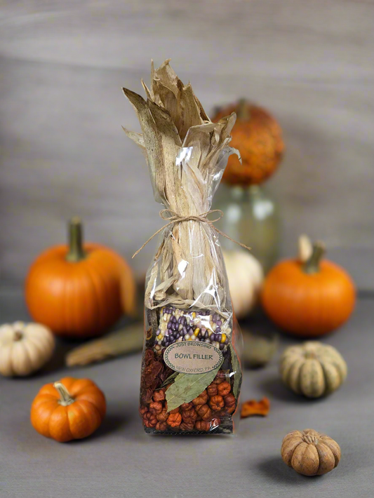 Decorative bottle filler with pumpkins on a gray background