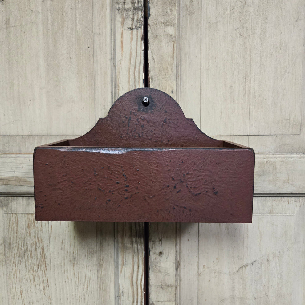 Rustic wood candle box on a wooden background