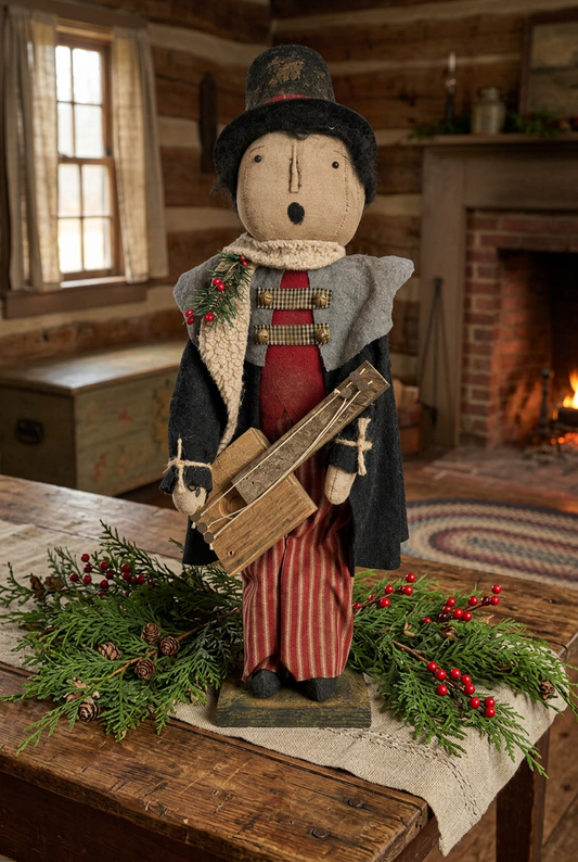 Primitive caroler doll on table in primitive home with fresh cedar greens and berries.