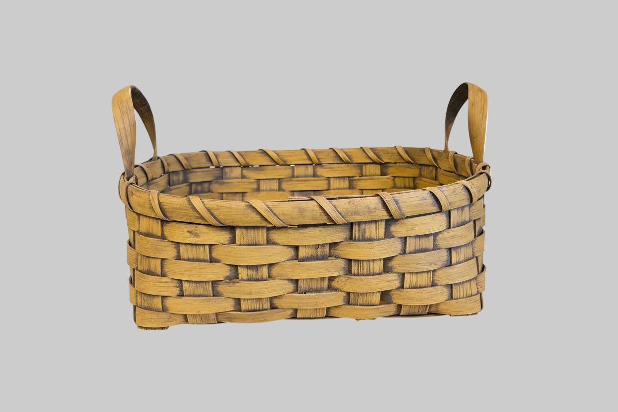 Woven basket on grey background