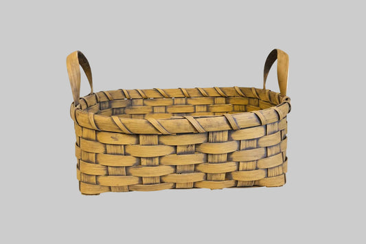 Woven basket on grey background