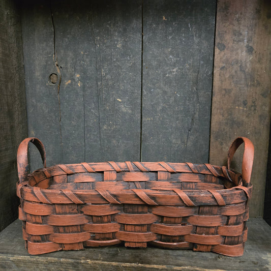 Woven basket on a wooden background