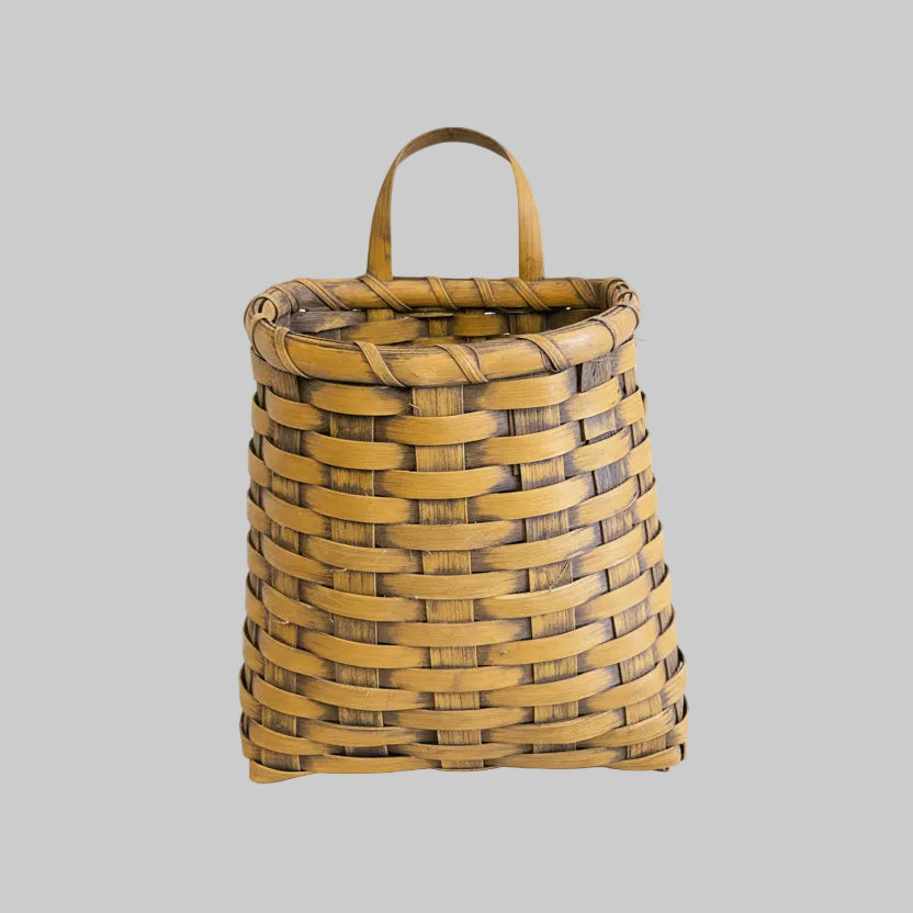 Woven basket on a grey background