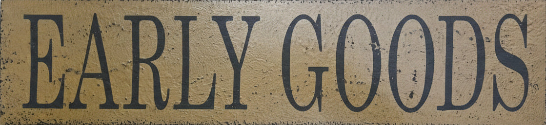 Wooden sign with 'EARLY GOODS' text on a wooden background