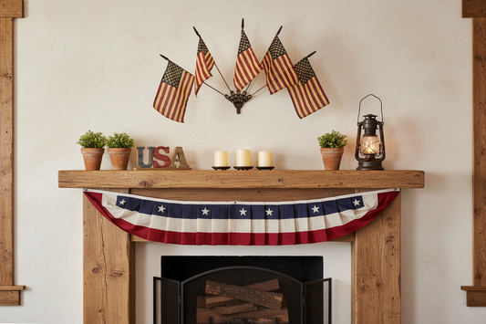 Decorative fireplace mantel with American flags, candles, and a bunting above a fireplace.
