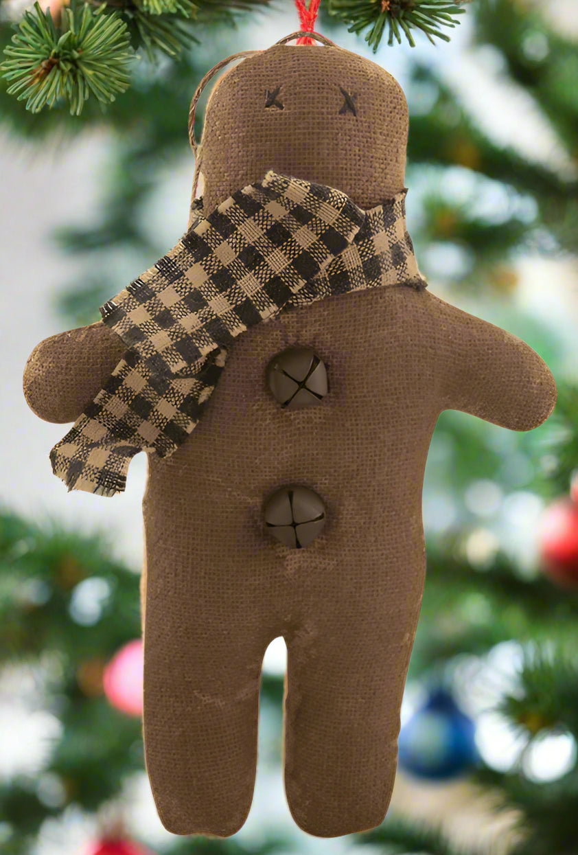 Primitive gingerbread with scarf ornament wearing checked scarf and rusty bells on front
