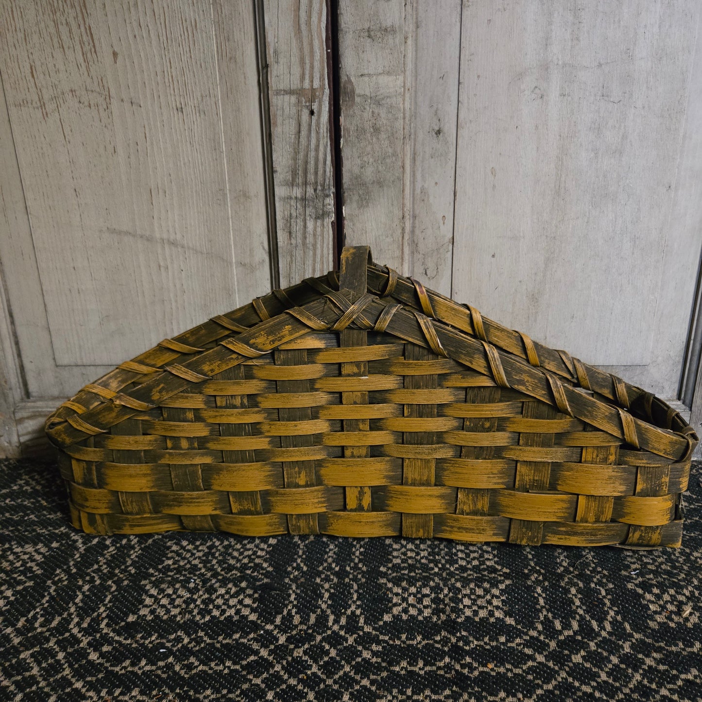 Mustard color basket on rustic background