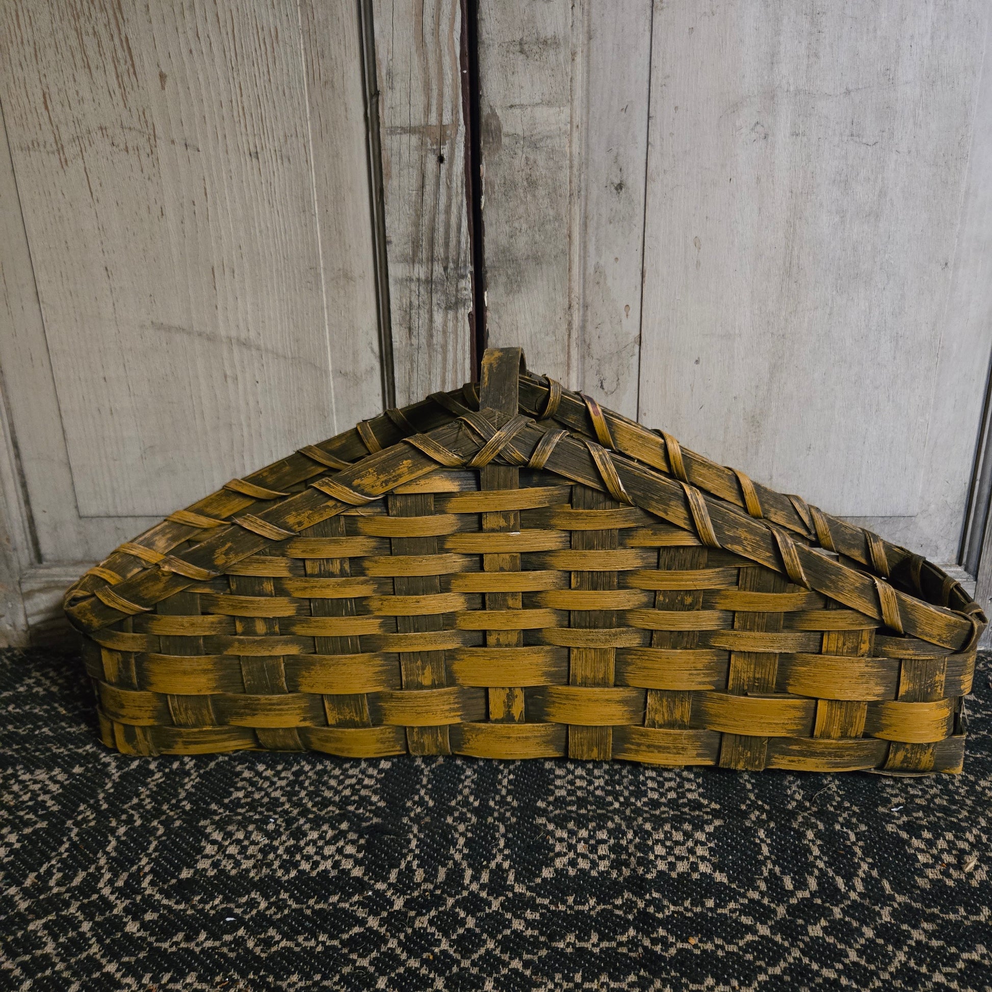 Mustard color basket on rustic background