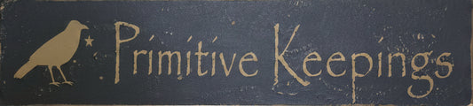 Wood sign with 'Primitive Keepings' text on a wooden background